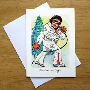 Blue Christmas Bigfoot greeting card front. Art by Colleen Scott-Jackson.