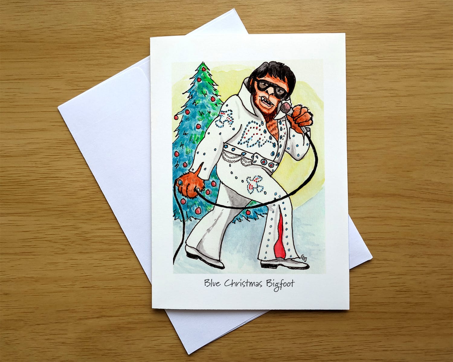 Blue Christmas Bigfoot greeting card front. Art by Colleen Scott-Jackson. Blue Christmas Bigfoot greeting card front. Art by Colleen Scott-Jackson.